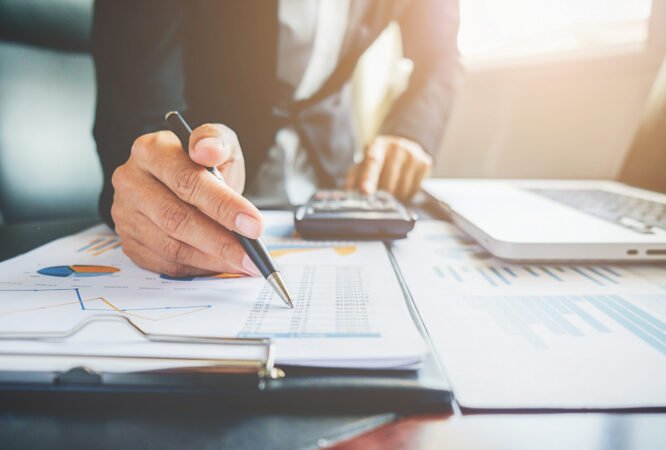 cooperation-analyst-chart-professional-paper-economics Business concept. Business people discussing the charts and graphs showing the results of their successful teamwork.
